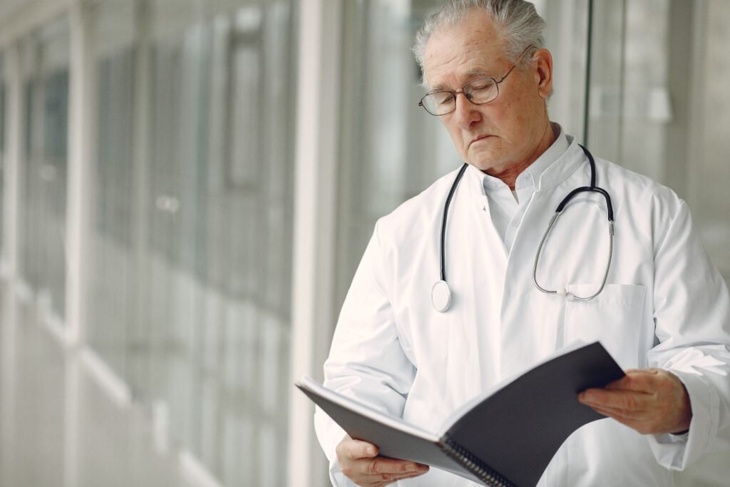 Doctor reviewing an older patient’s medical chart