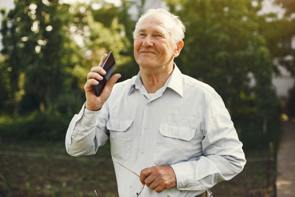 Senior man using a medical alert device