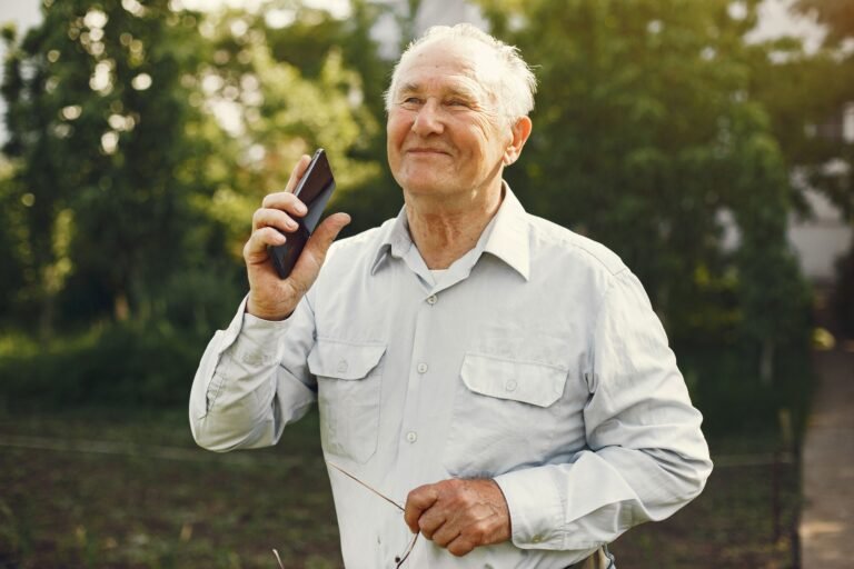 Senior man using a medical alert device