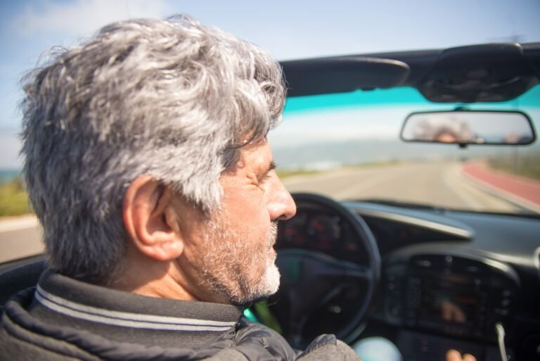 Older man driving a car