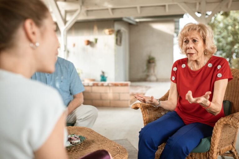 Older adults chatting in a relaxed group conversation