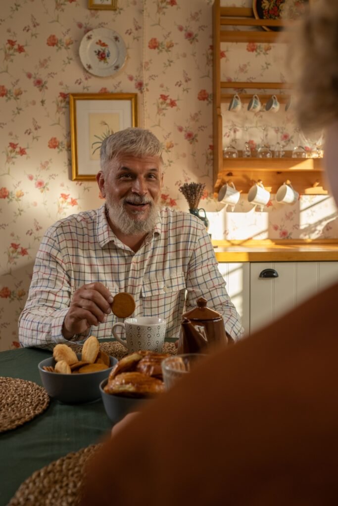 Older man enjoying a home-delivered meal at his kitchen table